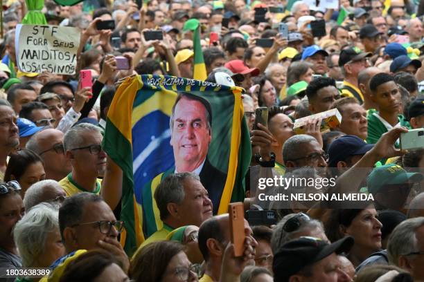 Supporters of former Brazilian president Jair Bolsonaro take part in a demonstration in Sao Paulo, Brazil, on November 26 for the democratic state...