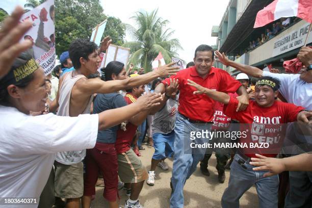 Peruvian presidential candidate, former Lieutenant Colonel Ollanta Humala, greets supporters during a rally in Puerto Maldonado, some 570 km...