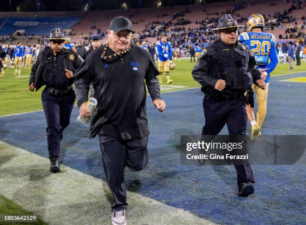 Bruins head coach Chip Kelly runs off the field after his team's 33-7 loss to California at the Rose Bowl on November 25, 2023 in Pasadena,...