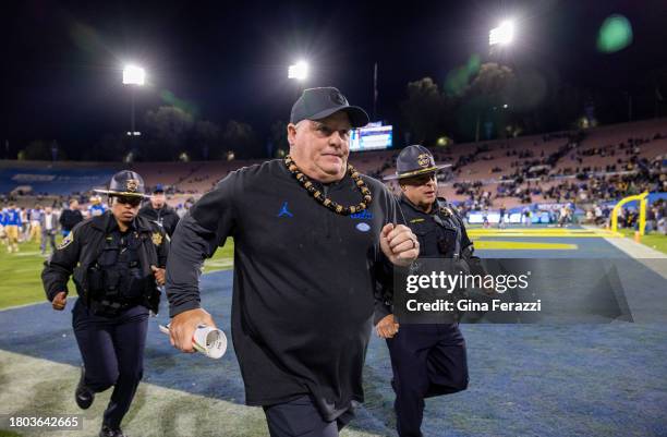 Bruins head coach Chip Kelly runs off the field after his team's 33-7 loss to California at the Rose Bowl on November 25, 2023 in Pasadena,...