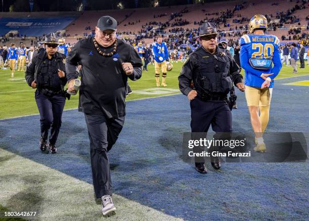 Bruins head coach Chip Kelly runs off the field after his team's 33-7 loss to California at the Rose Bowl on November 25, 2023 in Pasadena,...