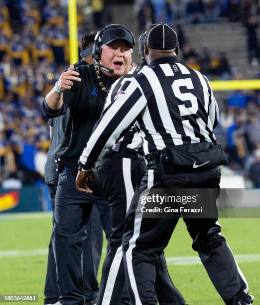 Bruins head coach Chip Kelly yells at the officials after his team was called for a defensive penalty against California in the first half at the...