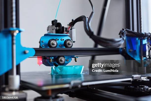 3d printer, machine and plastic in production, design and manufacturing industry. future, tech and polymer prototype, model and creative innovation, blue and electrical automation process closeup - 3d printen factory stockfoto's en -beelden