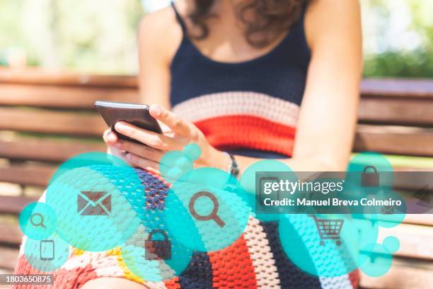woman with smart phone and icon applications - 30s font stock pictures, royalty-free photos & images