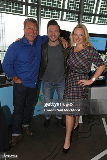 Neil Fox, Shane Filan and Verity Geere pose during Magic 105.4 FM's Live broadcast, promoting London's Biggest Breakfast fundraising event on...