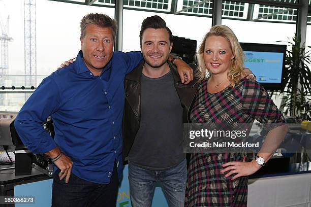 Neil Fox, Shane Filan and Verity Geere pose during Magic 105.4 FM's Live broadcast, promoting London's Biggest Breakfast fundraising event on...