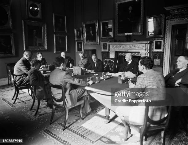 Members of the Royal Academy Selection Committee seated in a meeting room at Burlington House on Piccadilly in London in April 1946. Members of the...