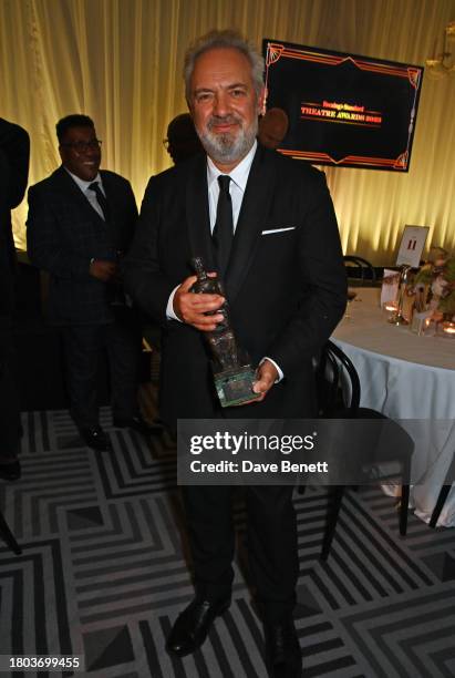 Sir Sam Mendes, winner of the Lebedev award, poses at The 67th Evening Standard Theatre Awards at Claridge's Hotel on November 19, 2023 in London,...