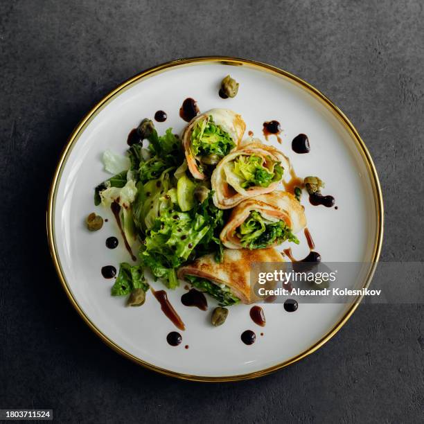 crepes with stuffed cream cheese, salmon and greens. lunch meal food concept. - maslenitsa stock pictures, royalty-free photos & images