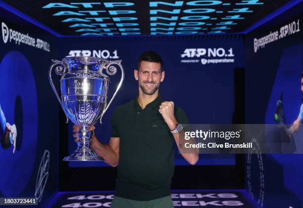 Novak Djokovic of Serbia with the ATP Year End World Number One Trophy and remains The World Number One for a record 400 weeks during day two of the...