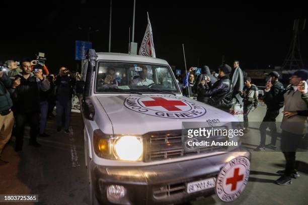 International Red Cross vehicles, carrying Israeli hostages released from Gaza, are on their way through the Rafah crossing to Egypt in Rafah, Gaza...