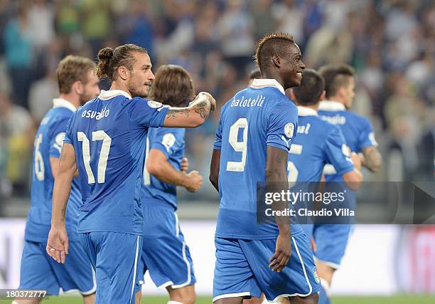 Mario Balotelli of Italy celebrates scoring the second goal during the FIFA 2014 World Cup Qualifier group B match between Italy and Bulgaria at...