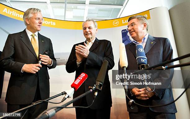 New IOC President Thomas Bach and Jacques Rogge pose during their arrival at Frankfurt Airport on September 12, 2013 in Frankfurt am Main, Germany.