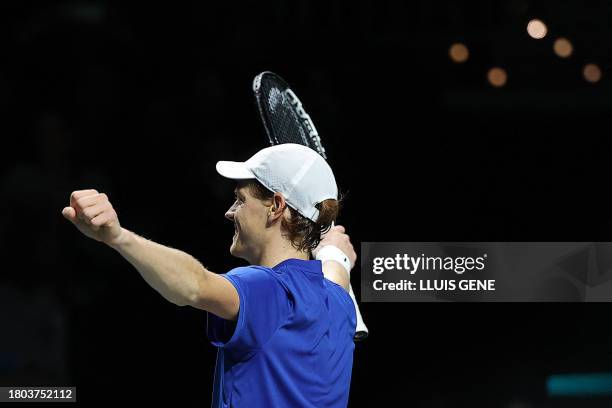 Italy's Jannik Sinner celebrates beating Australia's Alex de Minaur during the second men's singles final tennis match between Australia and Italy of...