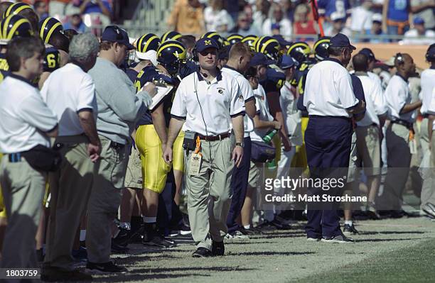 Quarterbacks coach Scot Loeffler of the Michigan Wolverines walks on the sidelines during the game against the Florida Gators in the Outback Bowl at...