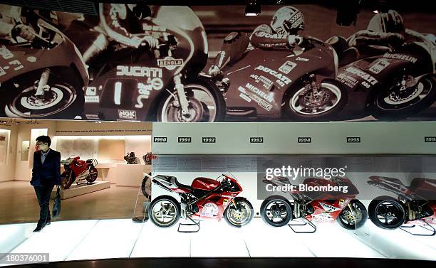 Ducati motorcycles, produced by Ducati Motor Holding SpA, stand on display at the company's museum in Bologna, Italy, on Wednesday, Sept. 11, 2013....