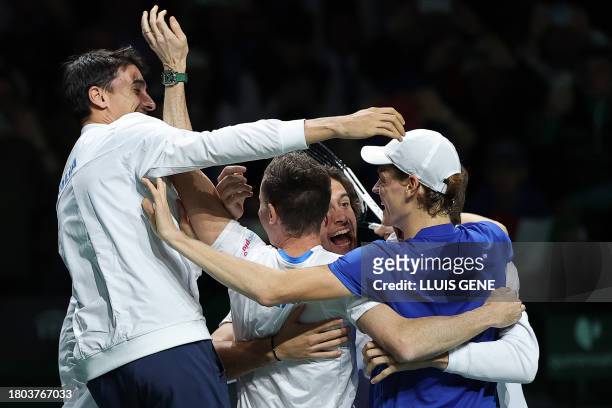 Italy's Jannik Sinner and teammates celebrate winning the Davis Cup tennis tournament after the second men's singles final tennis match between...