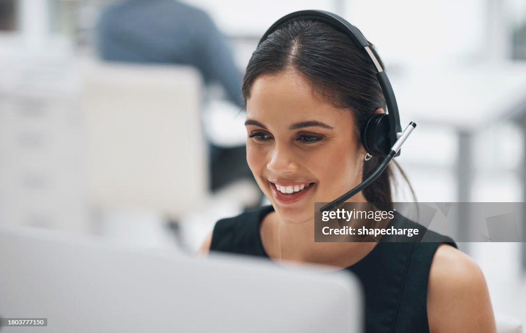 Happy woman, face and headphones in call center for customer service, telemarketing or support at office. Female person, consultant or agent smile with headset for online advice or help at workplace