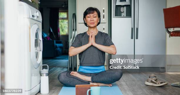 lotus prayer pose - washing machine front stock pictures, royalty-free photos & images