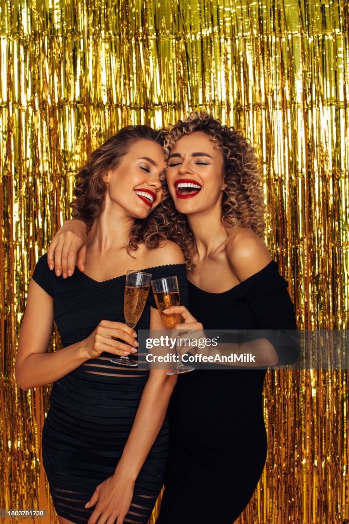 Photo of two beautiful girls enjoying party