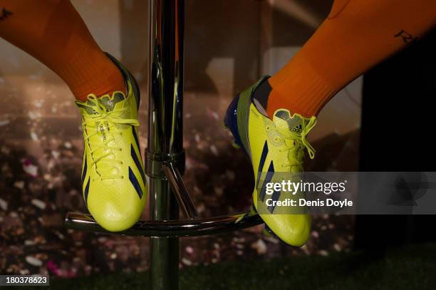 Gareth Bale of Real Madrid wears his Adidas Adizero F50 boots while presenting his team's UEFA Champions League kit for the 2014/2015 season at the...