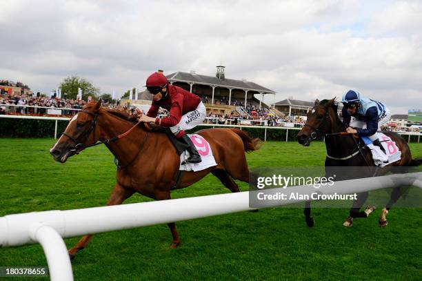 Jamie Spencer riding The Lark win The DFS Park Hill Stakes at Doncaster racecourse on September 12, 2013 in Doncaster, England.