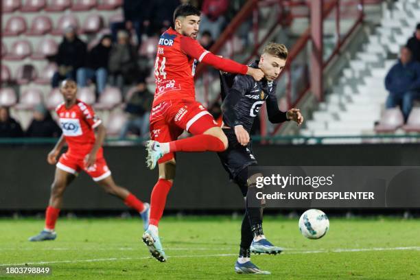Kortrijk's Joao Silva Eira Antunes and Mechelen's Norman Bassette fight for the ball during a soccer match between KV Kortrijk and KV Mechelen,...