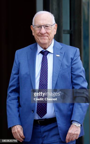 Former Israeli President Reuven Rivlin poses for photographers prior to a meeting with French President Emmanuel Macron at Elysee Palace on November...