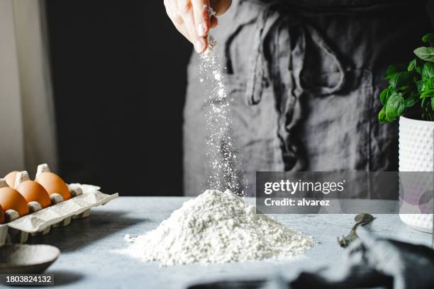 close-up of a woman preparing pasta dough in kitchen - yeast stock pictures, royalty-free photos & images