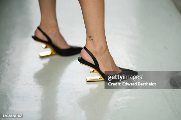 Heart Evangelista wears Fendi black leather pointed shoes with