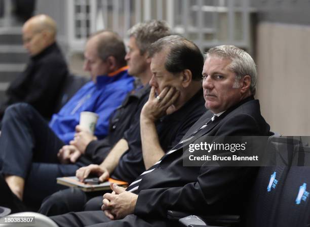 General Manager Garth Snow of the New York Islanders watches the teams first practice at the Barclays Center on September 12, 2013 in Brooklyn...