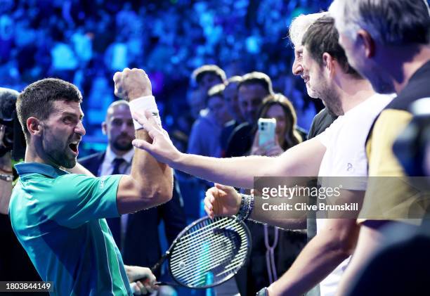 Novak Djokovic of Serbia celebrates to his team after victory against Jannik Sinner of Italy in the Men's Singles Finals between Jannik Sinner of...