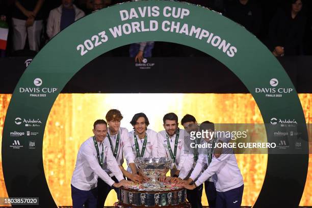 The members of team Italy celebrate winning the Davis Cup tennis tournament at the Martin Carpena sportshall, in Malaga on November 26, 2023.