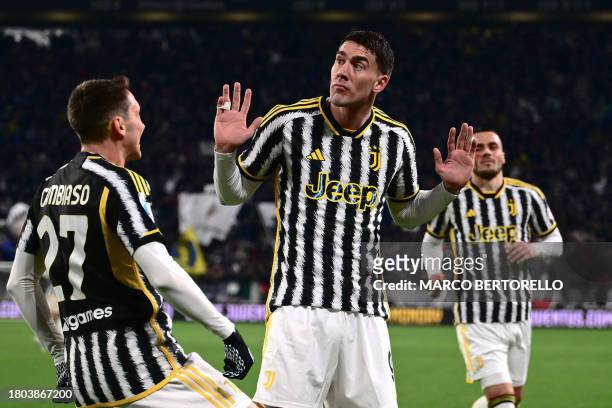 Juventus' Serbian forward Dusan Vlahovic reacts after scoring Juventus' first goal during the Italian Serie A football match between Juventus and...