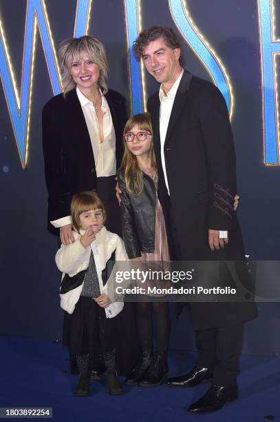 Italian actor and director Michele Riondino with make-up artist Eva Nestori and daughters attend the Italian premiere of Wish at Space Cinema Moderno...