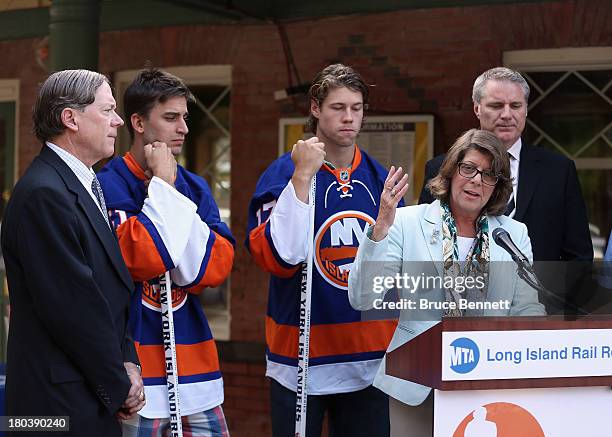 President of the Long Island Railroad, Helena E. Williams speaks to the media as John J. Watras the Mayor of Garden City, Franz Nielsen, Matt Moulson...