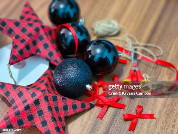 crafting for christmas: ornaments and materials on the holiday table - thimble stock pictures, royalty-free photos & images