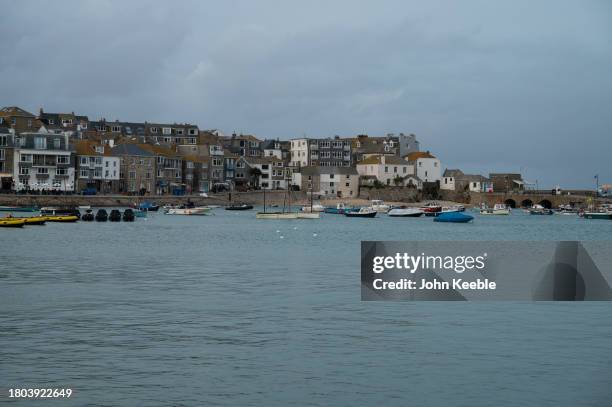 General view of residential properties over looking St. Ives Harbour at dusk on September 18, 2023 in St Ives, Cornwall, England.