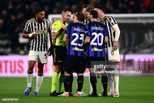 Italian referee Marco Guida talks to Inter Milan's Italian midfielder Nicolo Barella during the Italian Serie A football match between Juventus and...