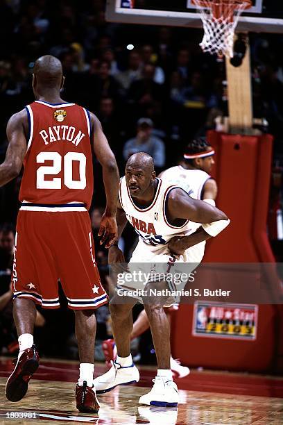 Michael Jordan of the Eastern Conference All-Stars defends Gary Payton of the Western Conference All-Stars during the 52nd NBA All-Star Game at the...