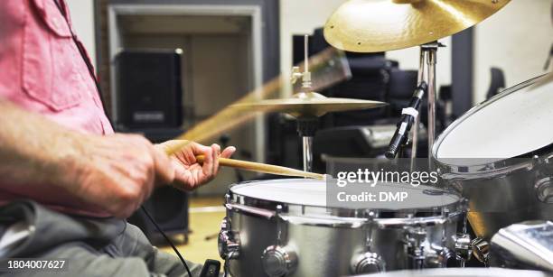 hands, drums and musician man at stage, play music or  rhythm sound at concert. closeup, percussion instrument and drumstick professional at event for performance of jazz, creative rock or speed blur - bass instrument stock pictures, royalty-free photos & images