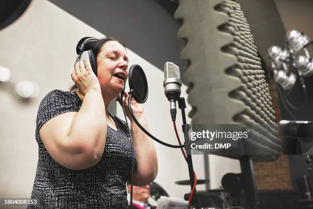 woman, singing and microphone in recording studio music in broadcast, artist for album performance. female person, headphones and audio passion job in creativity for rock, production or voice - east asian works of art specialist stock pictures, royalty-free photos & images