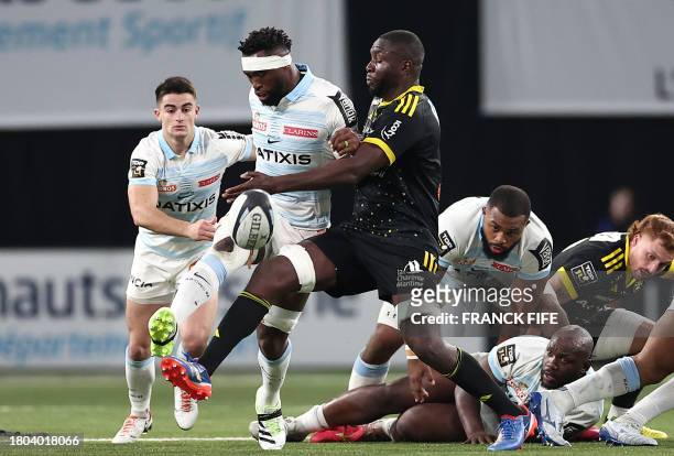 La Rochelle's French flanker Judicael Cancoriet fights for the ball with Racing 92's South African flanker Siya Kolisi during the French Top 14 rugby...