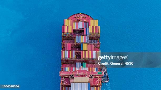 aerial top view of a generic cargo container ship at blue sea. - shipping container top view - fotografias e filmes do acervo