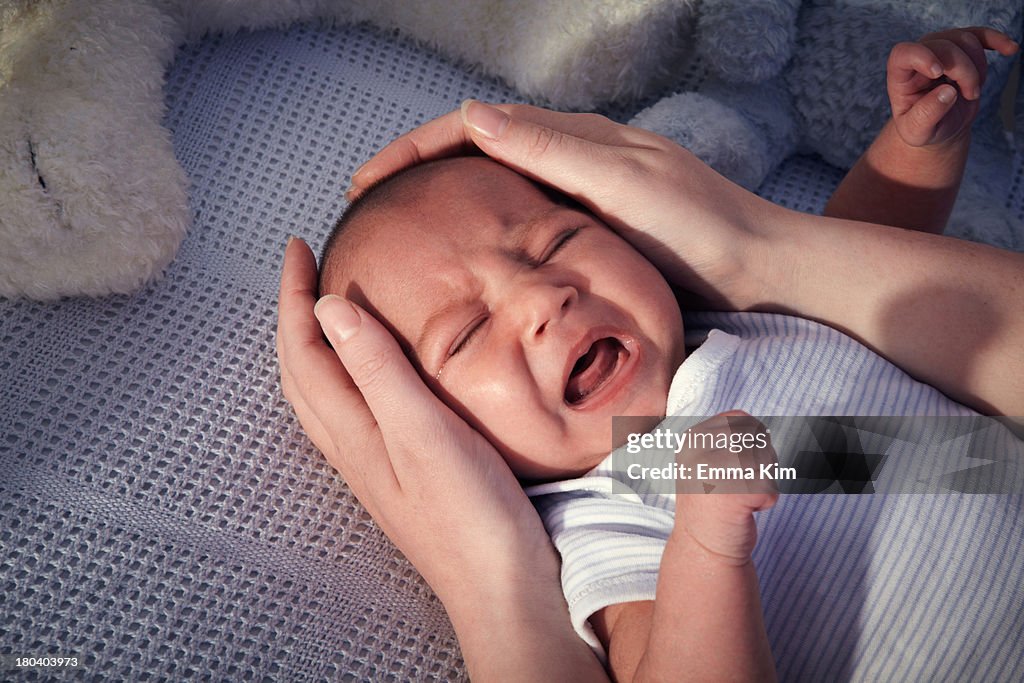 Baby boy in crib crying