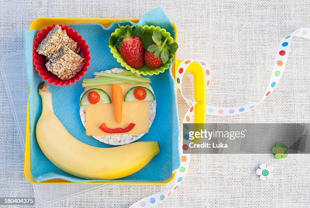 healthy food products made into smiley face - yellow ribbon stock pictures, royalty-free photos & images