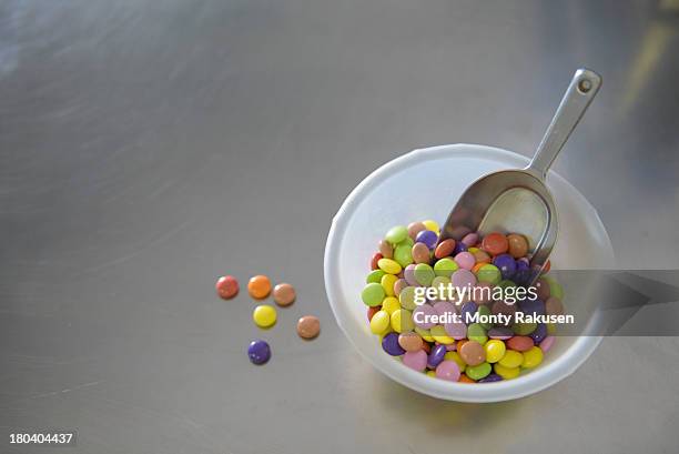 still life bowl of multi colored sweets - candy factory stockfoto's en -beelden