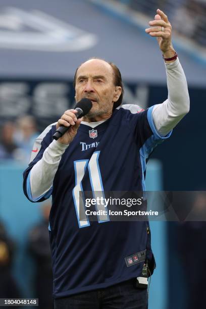 Country music artist Lee Greenwood sings his song God Bless the USA during a timeout of a game between the Tennessee Titans and Carolina Panthers,...