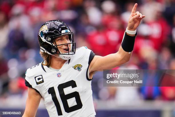 Trevor Lawrence of the Jacksonville Jaguars celebrates after scoring a touchdown against the Houston Texans during the first half at NRG Stadium on...