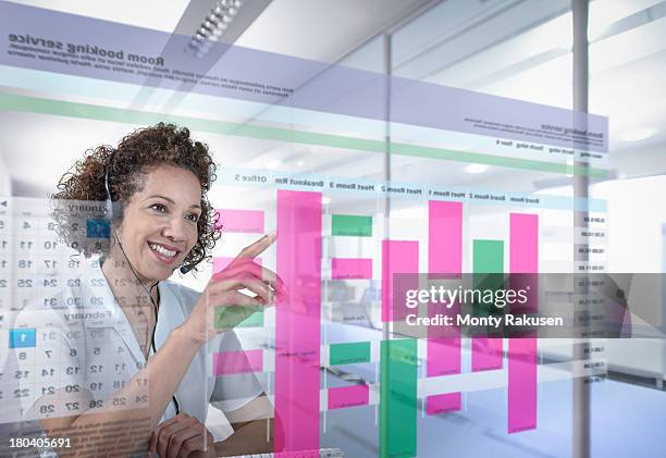 receptionist booking meeting rooms with interactive screen - transparent blouse stock pictures, royalty-free photos & images